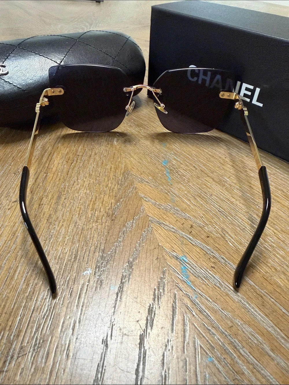 CHANEL Rimless Square Sunglasses in Dark Gradient with Gold Accents
